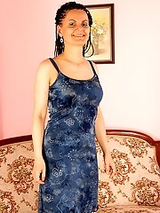 Mature brunette with big boobs shows off her shaven pussy